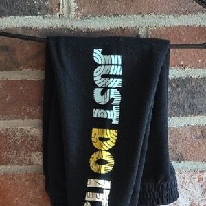 Nike Kids Black Joggers with Gold and Silver Accents